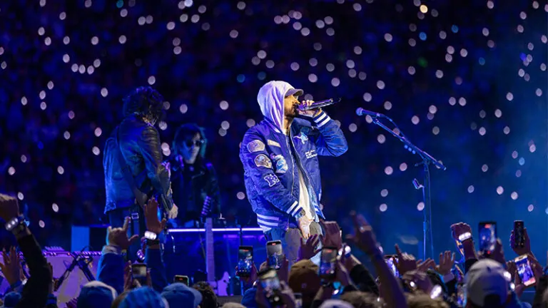 A smartphone screen displaying a countdown for a potential concert announcement.
